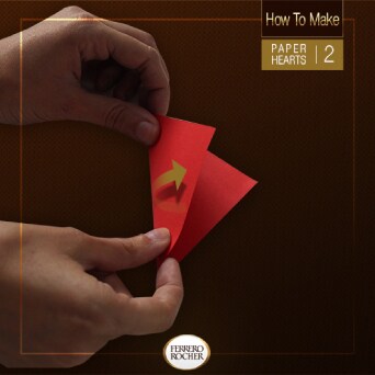 Fold the squares in half by matching two opposite corners.